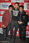 Comedians VIP and Raju Shrivastava are all smiles with John.