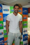 John Abraham looked like he had just jogged his way to the radio station as he turned up in a plain white T-shirt and track pants.
