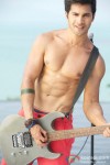 Hot hunk Varun Dhawan poses with a guitar in Student Of The Year Movie Stills