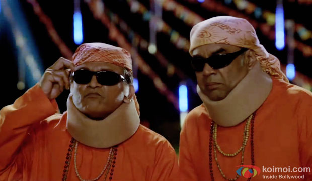 Annu Kapoor and Paresh Rawal in a still from movie 'Dharam Sankat Mein'