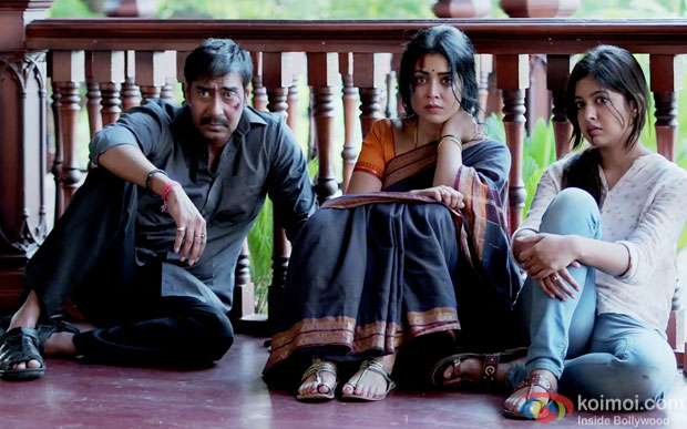 Ajay Devgn and Shriya Saran in a still from movie 'Drishyam'