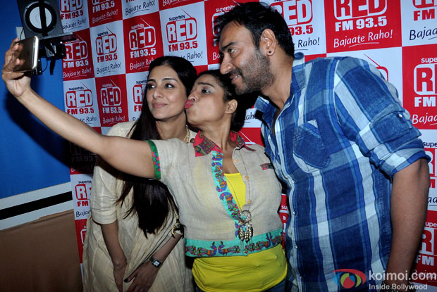 Tabu and Ajay Devgn during the promotion of movie Drishyam at Red FM 93.5