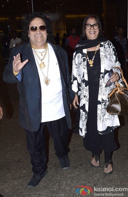 Bappi Lahari with wife Spotted At Airport