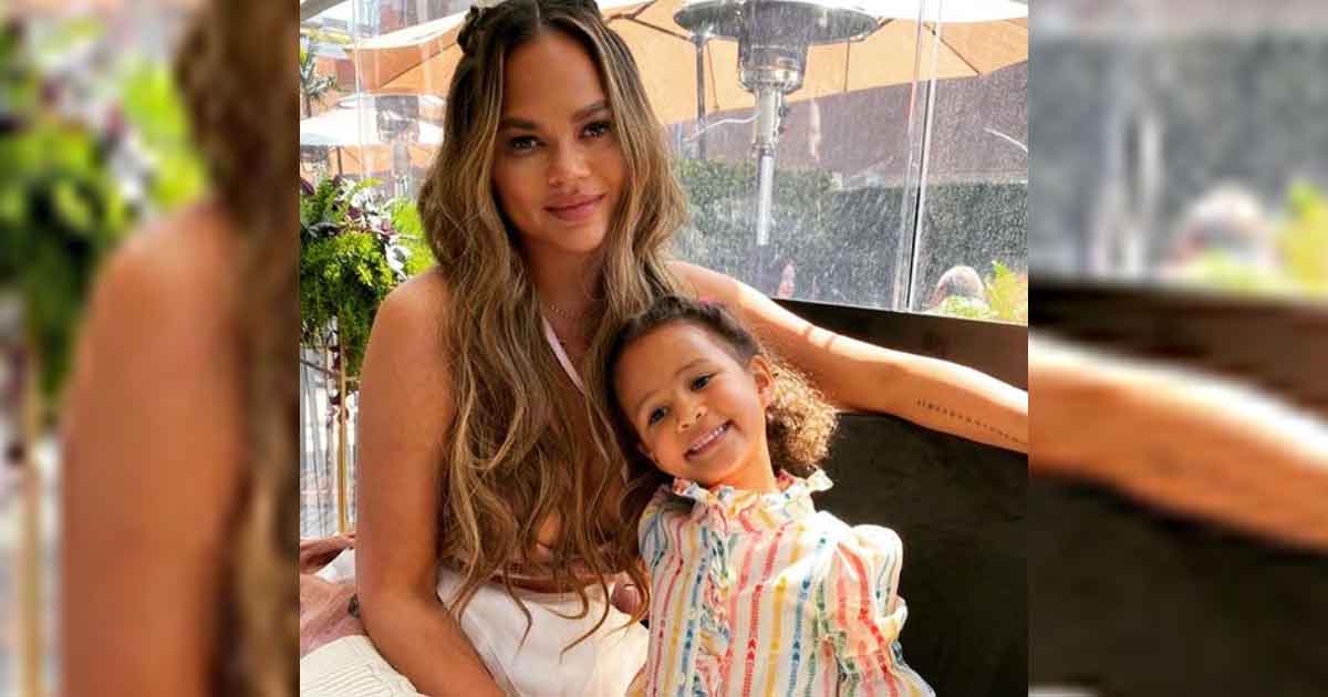 Chrissy Teigen, daughter Luna twin in black bikinis