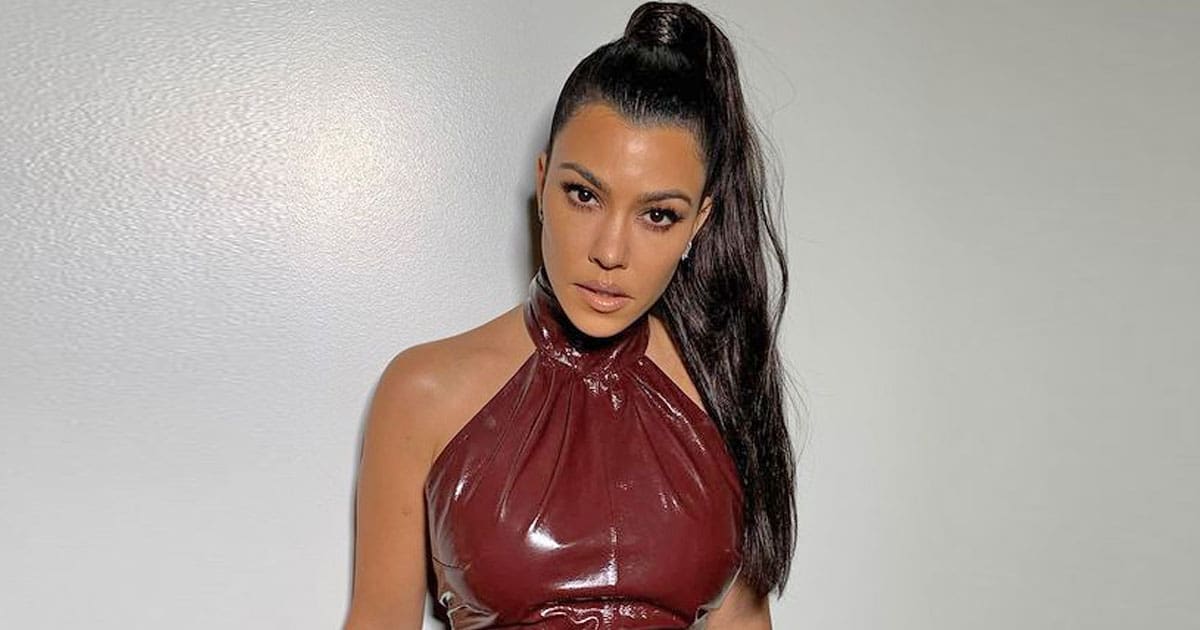 Kourtney Kardashian Dons A Purple Fendi Bikini Kissing Travis Barker, Fan Asks "Is That A Preg Belly?" Getting Slammed In Return