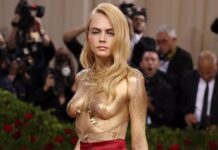 Cara Delevingne strips off to show gold-painted body on Met Gala red carpet