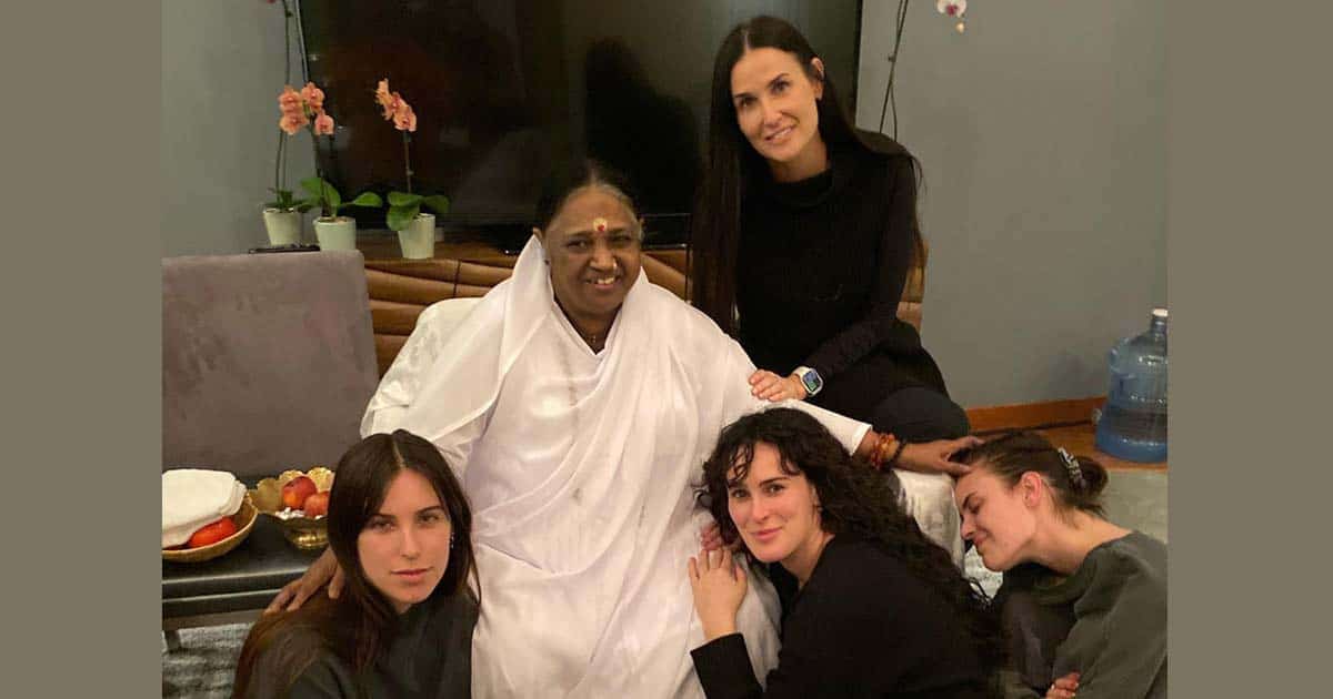 Demi Moore, daughters pose with spiritual figure Mata Amritanandamayi