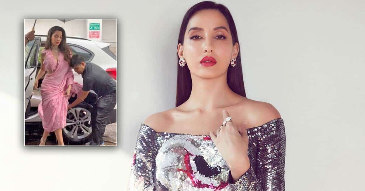 Nora Fatehi Gets Slammed For Making Her Security Personnel Hold Her Saree In Heavy Rain; Read On