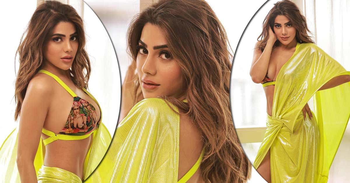 Nikki Tamboli Dons The Tiniest Possible Blouse Flaunting Her Cle*vage In A Thigh-High Slit Fluorescent Saree