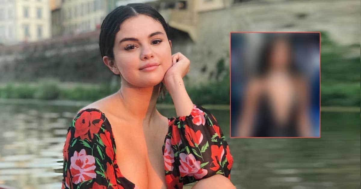Selena Gomez's voluptuous look in a plunging black satin dress showing off her voluptuous cleavage couldn't 