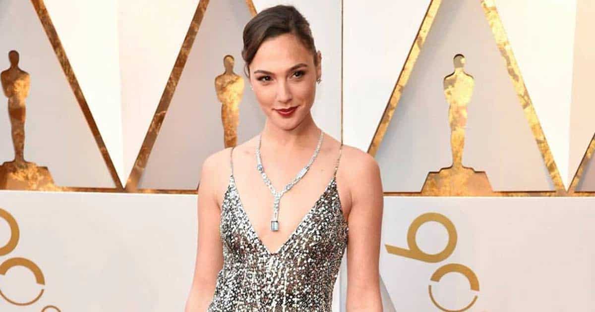 When Gal Gadot Dazzled In A Plunging Neckline Designed Silver Shimmery Gown & Made Us Wonder Her Sassiness!