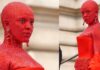 Doja Cat covered in red paint & 30,000 crystals for Paris Fashion Week