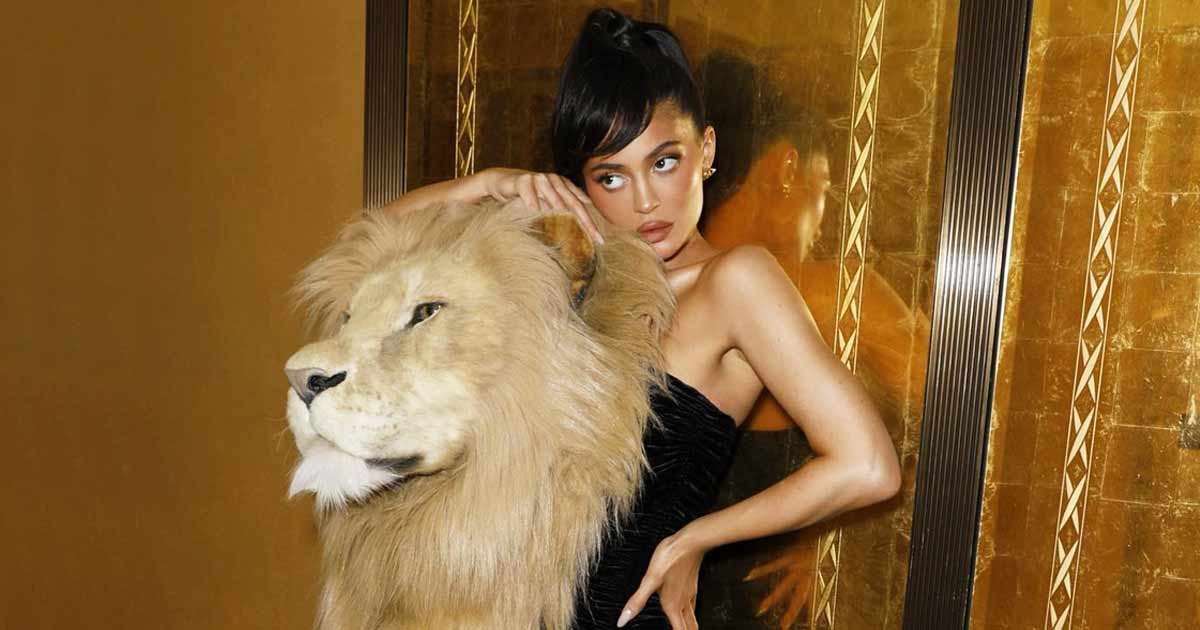 Kylie Jenner Turns Into A S*xy Huntress Dressed In A Figure-Hugging Black Dress With A Huge Lion's Head On Her Shoulders – Here’s How Netizens React