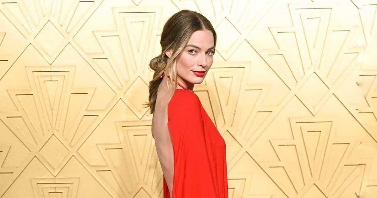 When Margot Robbie Paired Her Pink Scorching Lips With A Seducing Stare Scorching In A Plunging Neckline Saint Laurent Robe