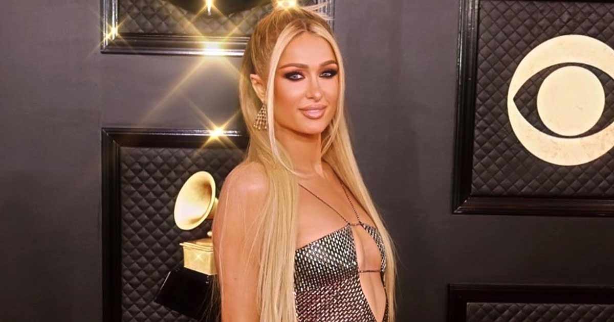 Paris Hilton Dodged Wardrobe Malfunction In A Strappy Silver Dress By Using A Sticker On Her N*pples