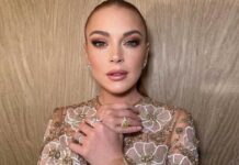Lindsay Lohan shows off baby bump in swimsuit