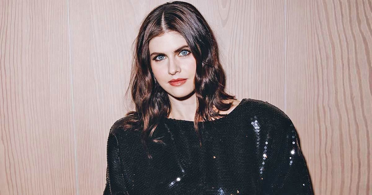 When Alexandra Daddario Wore A White Satin Br* Underneath A Shrug & Put Her B**bs On Show