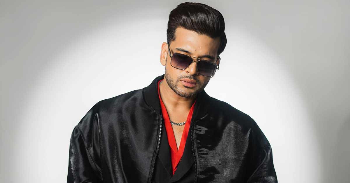 Karan Kundrra Will get Brutally Trolled As His Shiny Black Jacket Will get In contrast To A “Rubbish Bag”, Netizens Ask “Yeh Raincoat Kyun?”