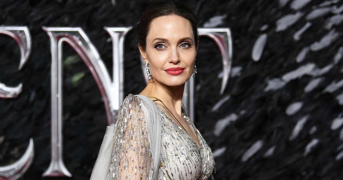 When Angelina Jolie Ditched Her Bra Went Topless Donned A Latex Overcoat With P Nty Making