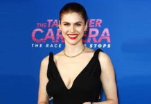 Alexandra Daddario Once Leaned To Put Her B*sty Cl*avage On Display Through The Plunging Neckline Of A White Monokini