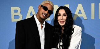 Back on! Cher confirms she’s back with toyboy lover Alexander ‘AE’ Edwards by getting cosy with him at Paris fashion show